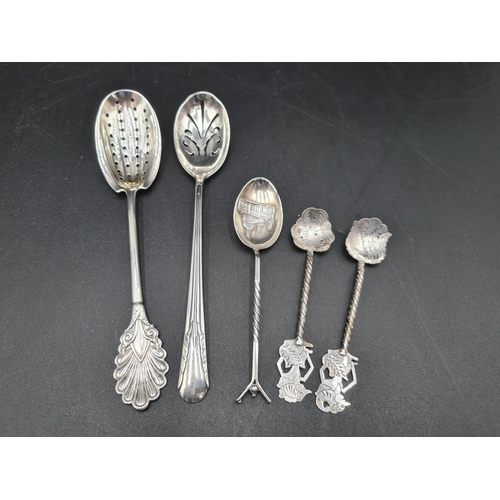 111 - An American Straining Spoon by Braverman & Levy, a sterling Straining Spoon, a Souvenir Spoon, Chest... 