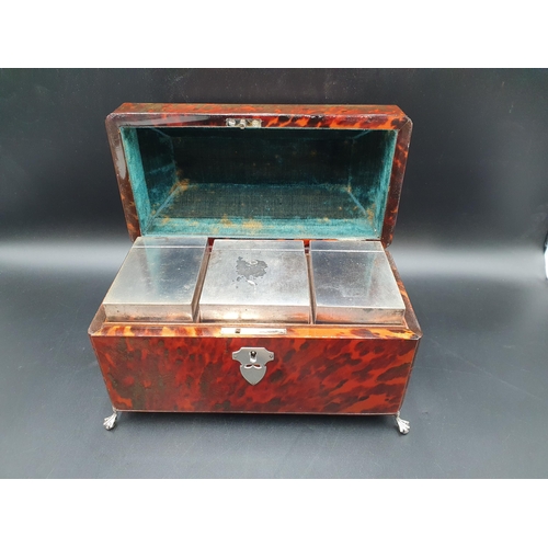 100 - A George III red tortoiseshell Tea Caddy of sarcophagus shape, the interior with three foil covered ... 