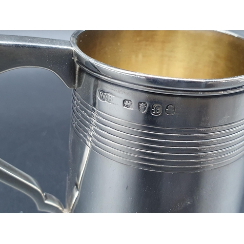 11 - A George IV silver Christening Mug of tapering form with reeded bands engraved initials M.A.C, Londo... 