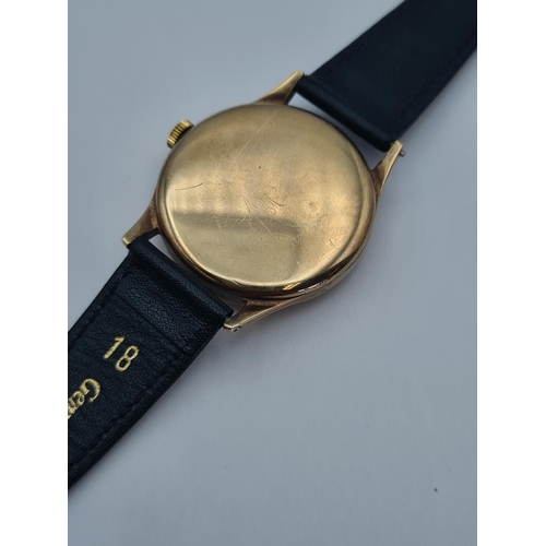 118 - A gentleman's manual wind Omega Wristwatch the champagne dial with alternating arabic numerals and d... 