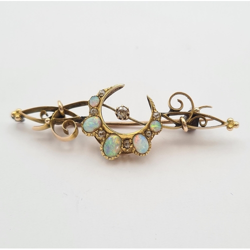 137 - A Diamond and Opal Star and Crescent Brooch claw-set old-cut diamonds and graduated oval opal caboch... 