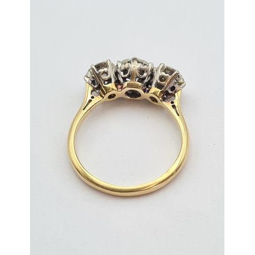 139 - A Diamond three stone Ring claw-set graduated brilliant-cut stones, estimated total diamond weight 1... 