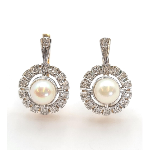 141 - A pair of Cultured Pearl and Diamond Earrings each set single central pearl within halo frame of ill... 