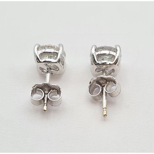 142 - A pair of Diamond Ear Studs each claw-set single brilliant-cut stone estimated 1ct in 18ct white gol... 