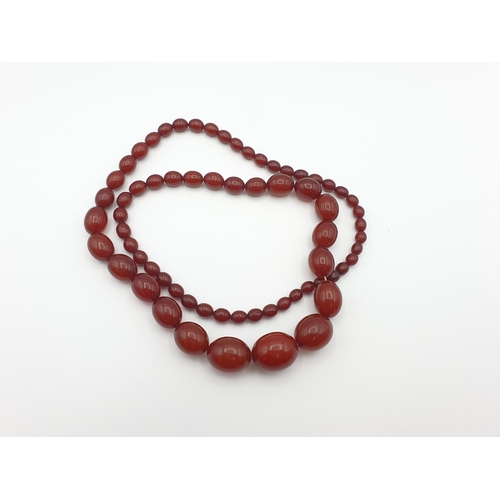 144 - A string of Cherry red Bakelite graduated Beads, approx 93gms, largest bead approx 21.40mm diameter,... 