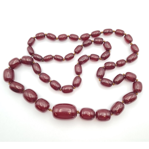 145 - A string of Cherry red Bakelite graduated Beads, approx 126gms, largest bead approx 24mm diameter, s... 