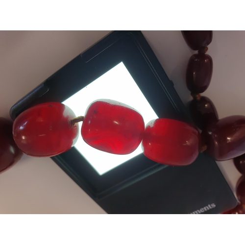 145 - A string of Cherry red Bakelite graduated Beads, approx 126gms, largest bead approx 24mm diameter, s... 