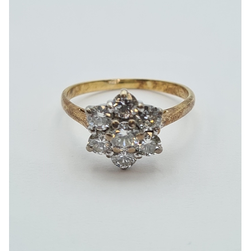 146 - A Diamond flower Cluster Ring claw-set seven brilliant-cut stones, estimated total weight 1ct, in 18... 