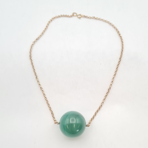 153 - A vintage Banded Agate Choker the green agate sphere suspended from a fine chain marked 9ct, agate b... 