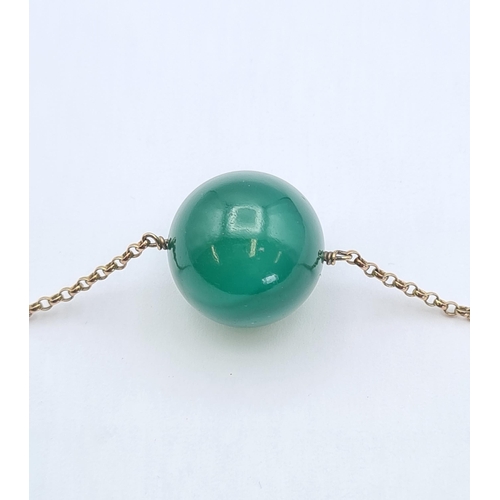 153 - A vintage Banded Agate Choker the green agate sphere suspended from a fine chain marked 9ct, agate b... 