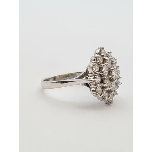 155 - A hexagonal Diamond Cluster Ring claw-set nineteen brilliant-cut stones in white gold stamped 18ct, ... 