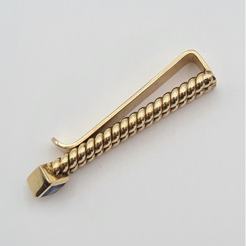 157 - A Sapphire Tie Clip set square step-cut stone, stamped 14K, approx 39mm long, approx 7.60gms