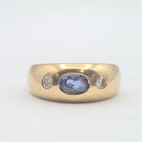 158 - A Sapphire and Diamond three stone Ring gypsy-set oval-cut sapphire between two brilliant-cut diamon... 