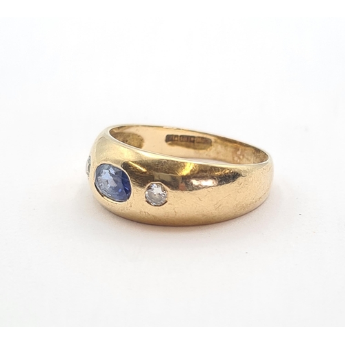 158 - A Sapphire and Diamond three stone Ring gypsy-set oval-cut sapphire between two brilliant-cut diamon... 