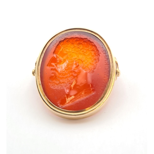 159 - A gold swivel Intaglio Seal/Ring set carnelian carved classical bust and engraved Greek script, unma... 