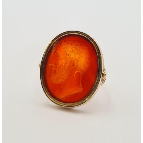 159 - A gold swivel Intaglio Seal/Ring set carnelian carved classical bust and engraved Greek script, unma... 