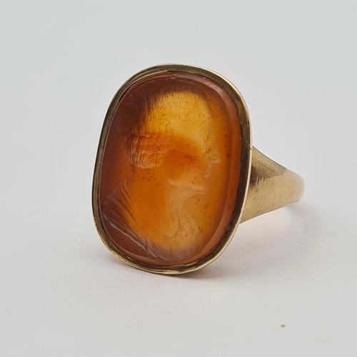 160 - An Intaglio Seal Ring the carnelian carved classical bust in profile, stamped 9ct, ring size O, appr... 