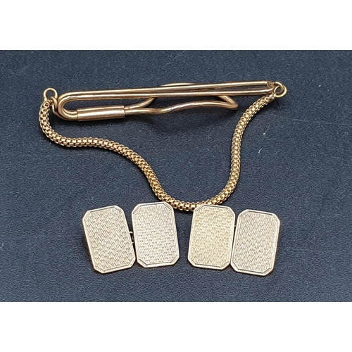 161 - A pair of 9ct gold Cuff Links with engine turning, Birmingham 1964 and a plated Tie Clip