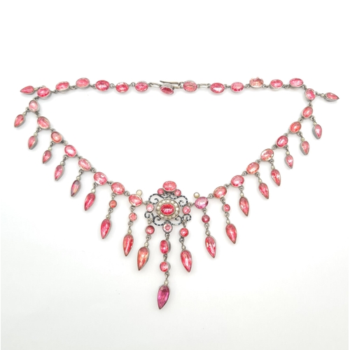 164 - An antique French paste and seed pearl Fringe Necklace close-set foil backed pink stones in white me... 