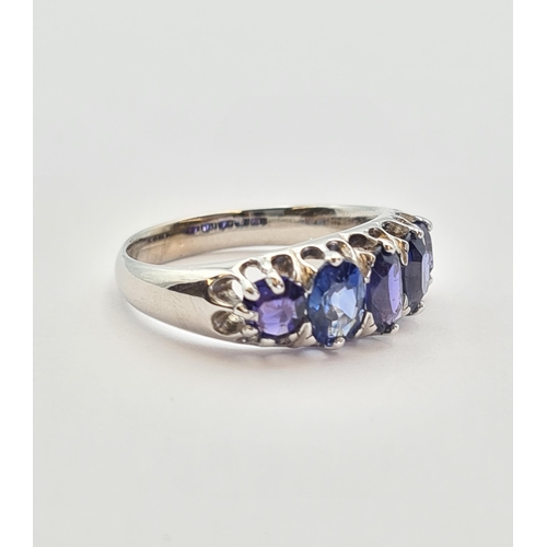 165 - A Sapphire five stone Ring claw-set graduated oval-cut stones, one stone replaced, in white gold, ri... 