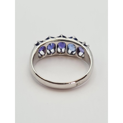 165 - A Sapphire five stone Ring claw-set graduated oval-cut stones, one stone replaced, in white gold, ri... 