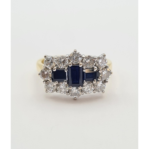 175 - A Sapphire and Diamond Cluster Ring claw-set three step-cut sapphires within a frame of twelve brill... 