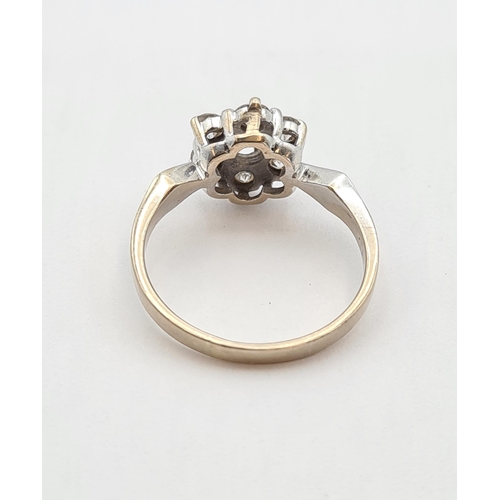 178 - A Diamond flower Cluster Ring claw-set seven brilliant-cut stones in 18ct gold, ring size O, approx ... 