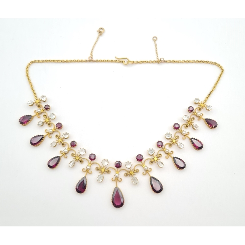 180 - A Victorian Garnet, Goshenite (white beryl) and Seed Pearl Fringe Necklace the front claw-set altern... 