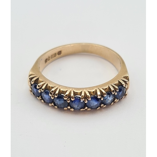 181 - A Sapphire half Eternity Ring set seven round stones in 9ct gold, ring size M 1/2, approx 3gms