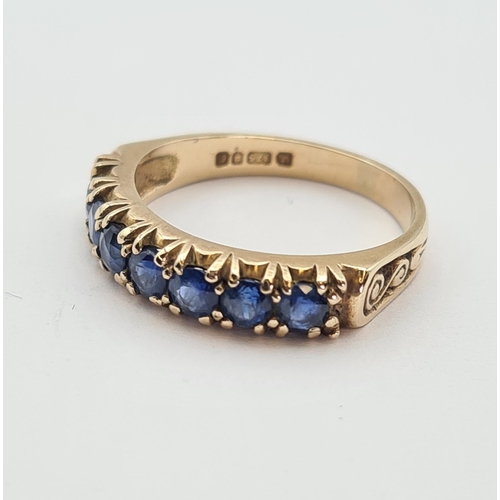 181 - A Sapphire half Eternity Ring set seven round stones in 9ct gold, ring size M 1/2, approx 3gms