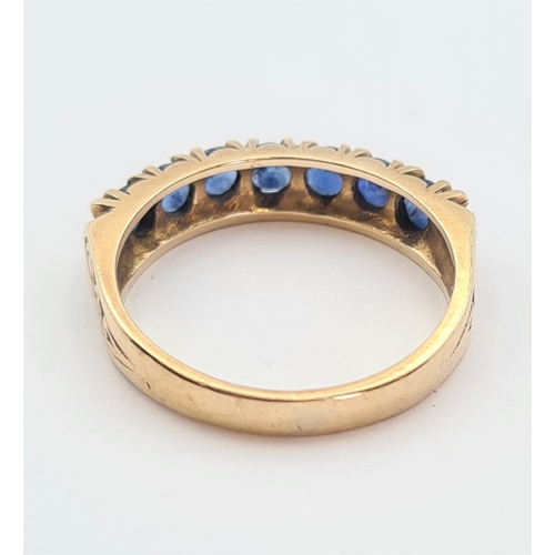 181 - A Sapphire half Eternity Ring set seven round stones in 9ct gold, ring size M 1/2, approx 3gms