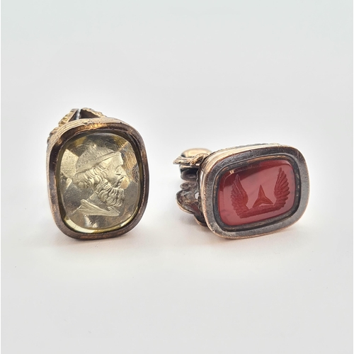 185 - Two yellow metal Seal Fobs each set stones intaglio carved with crest and hand respectively, approx ... 