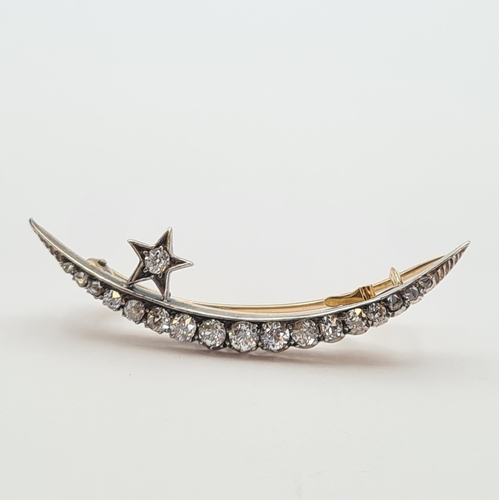 186 - A Diamond Star and Crescent Brooch set graduated old and rose-cut stones in silver backed with gold,... 