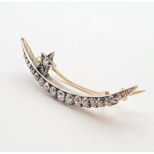 186 - A Diamond Star and Crescent Brooch set graduated old and rose-cut stones in silver backed with gold,... 