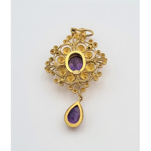 189 - A late 19th Century Amethyst and Garnet Pendant claw-set oval-cut amethyst within four round green g... 