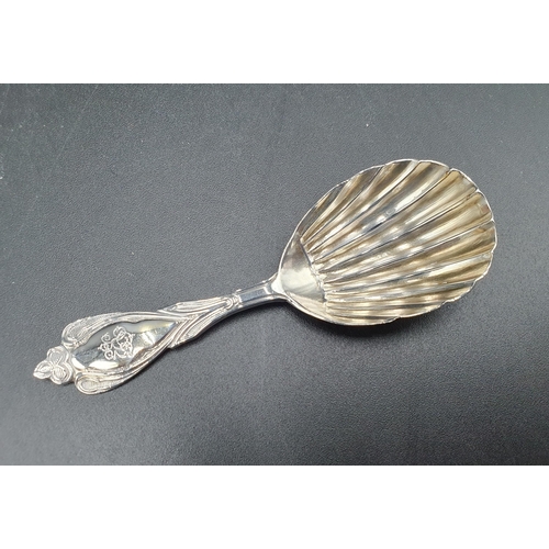 19 - A Victorian silver Caddy Spoon with shell bowl and ornate stem engraved initials, London 1868, and a... 