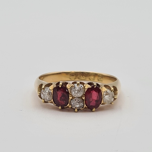 190 - A Diamond and Ruby Ring claw-set two old-cut diamonds between two oval-cut rubies and two further di... 