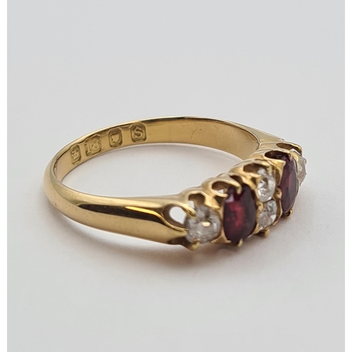 190 - A Diamond and Ruby Ring claw-set two old-cut diamonds between two oval-cut rubies and two further di... 