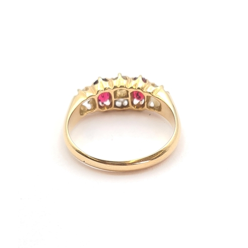 190 - A Diamond and Ruby Ring claw-set two old-cut diamonds between two oval-cut rubies and two further di... 