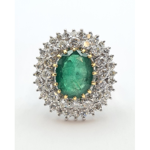 195 - An Emerald and Diamond Cocktail Ring claw-set oval-cut emerald, 6.45cts, within double frame of bril... 