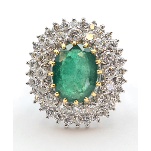 195 - An Emerald and Diamond Cocktail Ring claw-set oval-cut emerald, 6.45cts, within double frame of bril... 