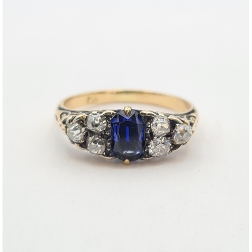 202 - A Victorian Sapphire and Diamond boat shaped Ring set cushion-cut sapphire between two trios of old-... 