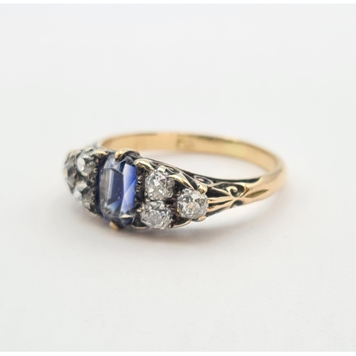 202 - A Victorian Sapphire and Diamond boat shaped Ring set cushion-cut sapphire between two trios of old-... 