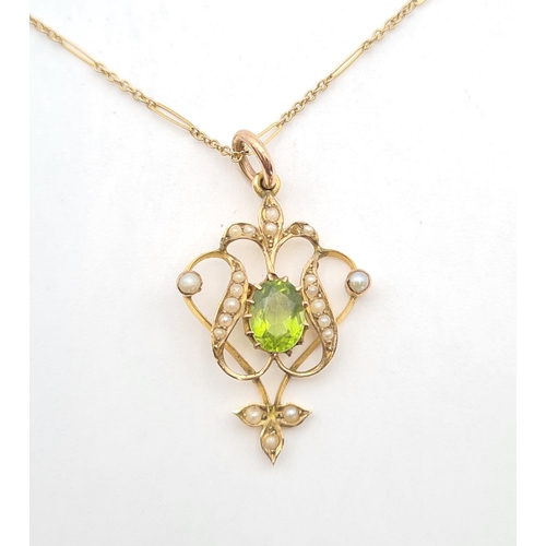 206 - An Edwardian Peridot and Seed Pearl Pendant the openwork plaque claw-set oval-cut peridot within see... 