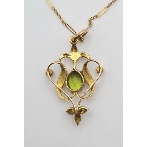 206 - An Edwardian Peridot and Seed Pearl Pendant the openwork plaque claw-set oval-cut peridot within see... 