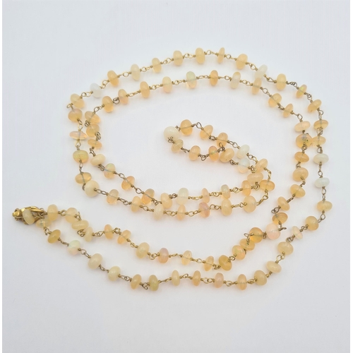 207 - An Opal Bead Necklace on silver gilt clasp and silver gilt links between beads, approx 90cms long