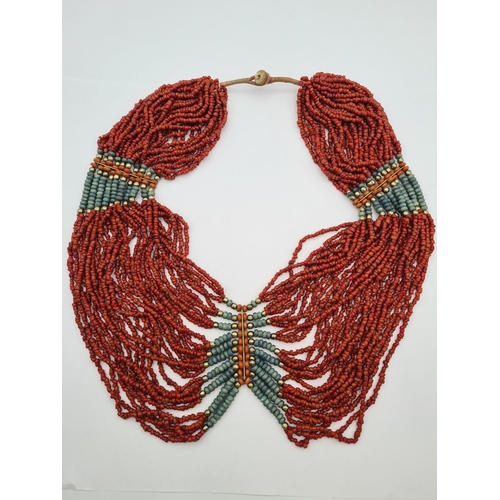 215 - An Indian multi-strand Coral Bead Necklace