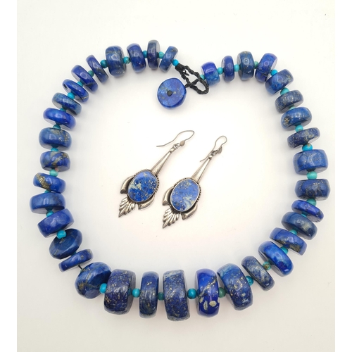 216 - A heavy graduated Lapis Lazuli Necklace the disc shaped beads interspersed with small turquoise bead... 