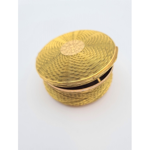 225 - A circular gold plated Trinket Box with basket weave effect and hinged lid, approx 7cms diameter