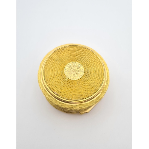 225 - A circular gold plated Trinket Box with basket weave effect and hinged lid, approx 7cms diameter